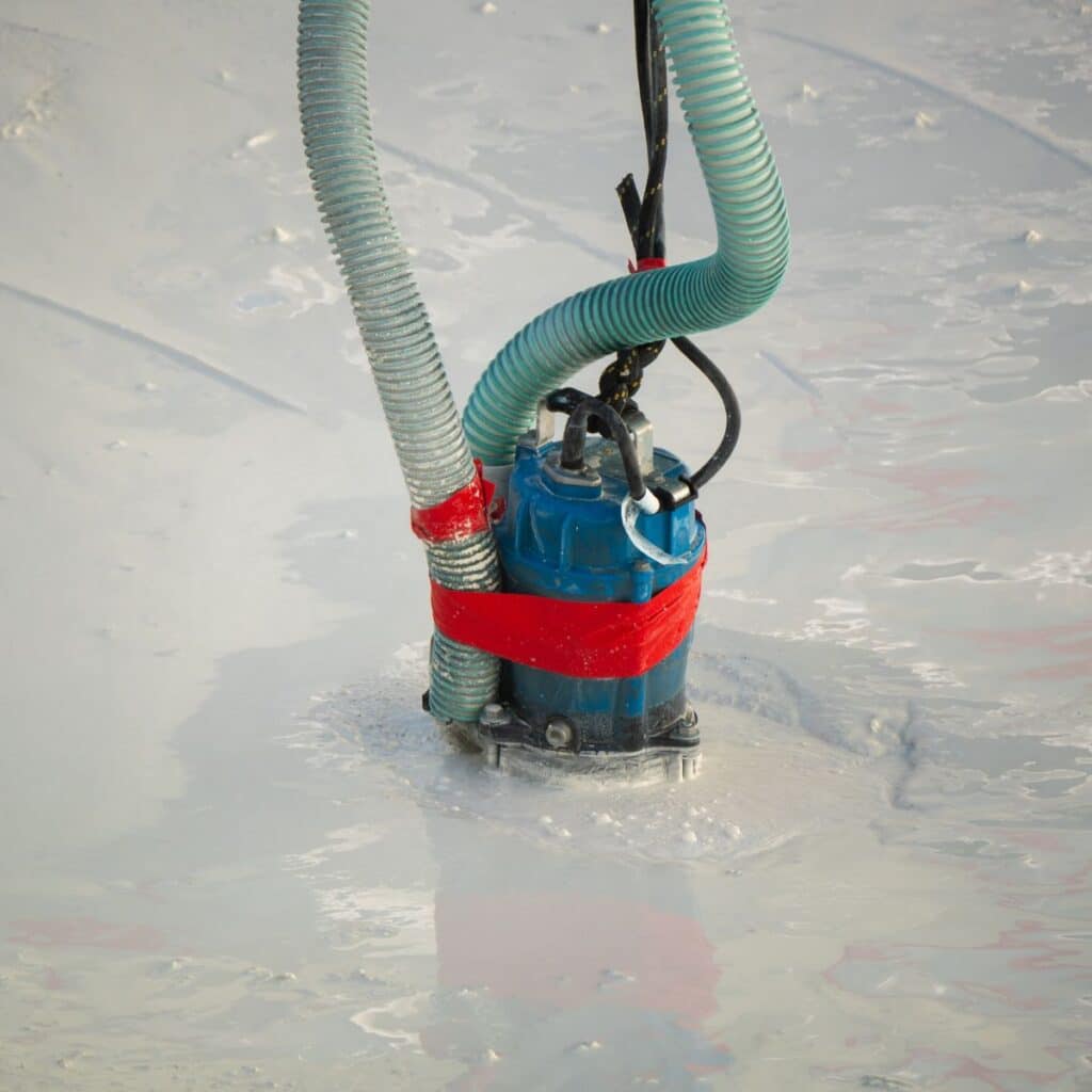 sump pump removing water from a basement