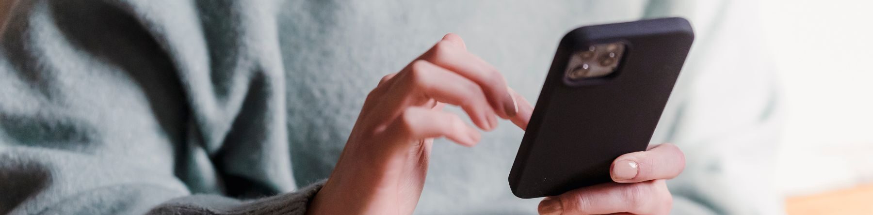 woman scrolling on her phone