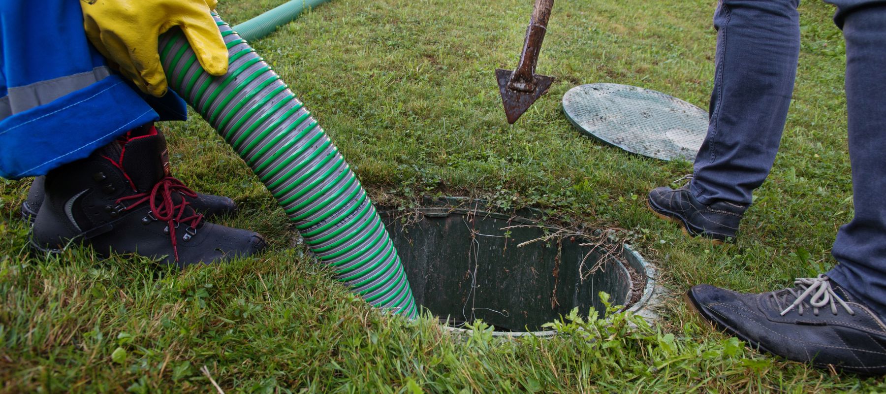 sewer line being cleaned out with a high pressure hose